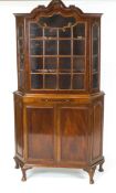 A mahogany Dutch style display cabinet with one glazed door above a candleslide