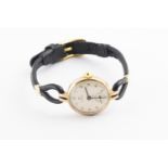 A Cyma wristwatch on a leather strap. Case reference: 10494. Hallmarked 9ct gold, London, 1963. 13.