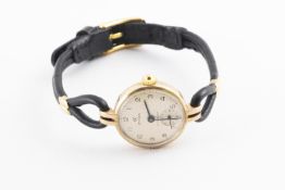 A Cyma wristwatch on a leather strap. Case reference: 10494. Hallmarked 9ct gold, London, 1963. 13.