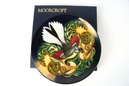 A Moorcroft pottery plate decorated with the Fantail pattern, factory marks, circa 2003,