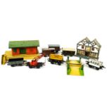 A Triang electric model railway, to include a station, crane, wagons, trains and track,