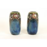 A pair of Royal Doulton stoneware vases of tapering cylindrical form