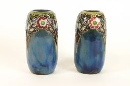 A pair of Royal Doulton stoneware vases of tapering cylindrical form