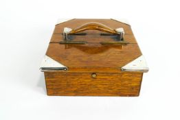 An Edwardian oak humidor, silver mounted cigar box, of rectangular section,