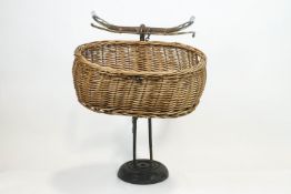 A vintage bicycle display stand, the assembled bicycle parts, including handle bars,