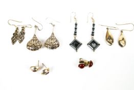 A collection of six pairs of earrings of variable designs. Most are marked for sterling silver 925.