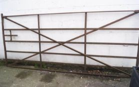 An iron six bar gate 123cm x 282cm