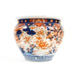 A large 19th century porcelain imari planter decorated in the imari palette with a pheasant