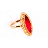 A yellow metal dress ring set with a marquise cut synthetic ruby.