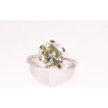 A white metal single stone ring. Set with a round cut cubic zirconia.
