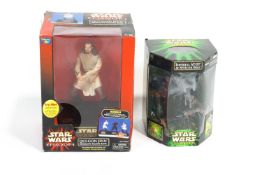 Two boxed Star Wars collectors pieces being a think way Qui-Gon Jinn interactive talking bank,