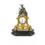 A Continental gilt metal mantle clock on embossed wood stand,