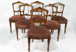 A set of six Victorian salon chairs, each with boxwood and walnut inlay with stuff-over seats,