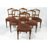 A set of six Victorian salon chairs, each with boxwood and walnut inlay with stuff-over seats,