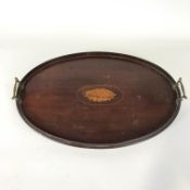 An inlaid Edwardian oval wood tray, inlaid wth a Sheraton shell, in the Georgian style,