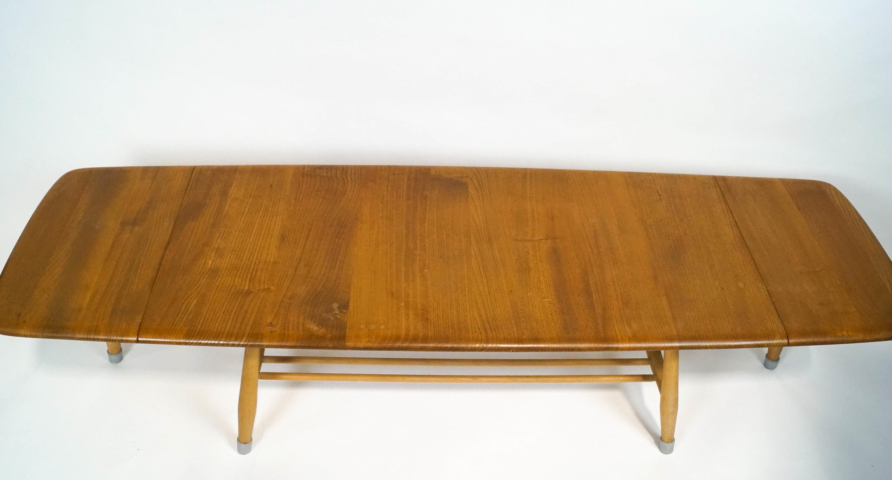 An Ercol light elm drop-leaf low coffee table, of rectangular form, with lower tier on splayed legs, - Image 2 of 2