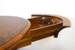 A late 20th/early 21st century oval walnut desk by Touchwood, with central flared support,