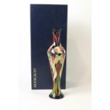 A Moorcroft pottery vase of slender form decorated with the Trinity pattern,