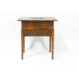 A pine and oak carved sewing table,