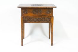 A pine and oak carved sewing table,