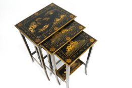 A nest of three chinoiserie lacquered occasional tables, each of rectangular form, on splayed feet,