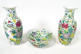 A modern Chinese famille rose style pair of necked vases, a large bowl,