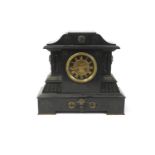A continental slate and metal mounted clock,