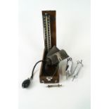 An Accoson blood pressure monitor in mahogany case,