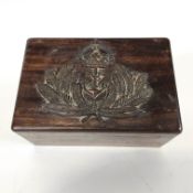 A carved wood military box containing a collection of brass and gilt metal naval and RAF buttons