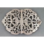 A cast and chased silver openwork belt buckle in the scrolling foliate baroque style, Chester 1894,