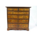 A late Victorian walnut chest of two short and four long graduated drawers