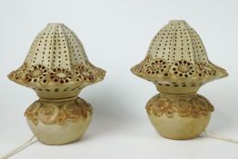A pair of Bernard Rooke stoneware lamp bases applied and impressed with flower heads and circles