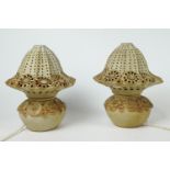 A pair of Bernard Rooke stoneware lamp bases applied and impressed with flower heads and circles