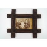 A marine art wood frame, inscribed 'Frame made by father of Mrs (?) from cigar boxes,