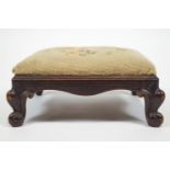 A small mahogany foot stool of square form raised on cabriole legs,