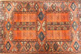 A rug with medallions on a red field with a series of medallions in a wide border