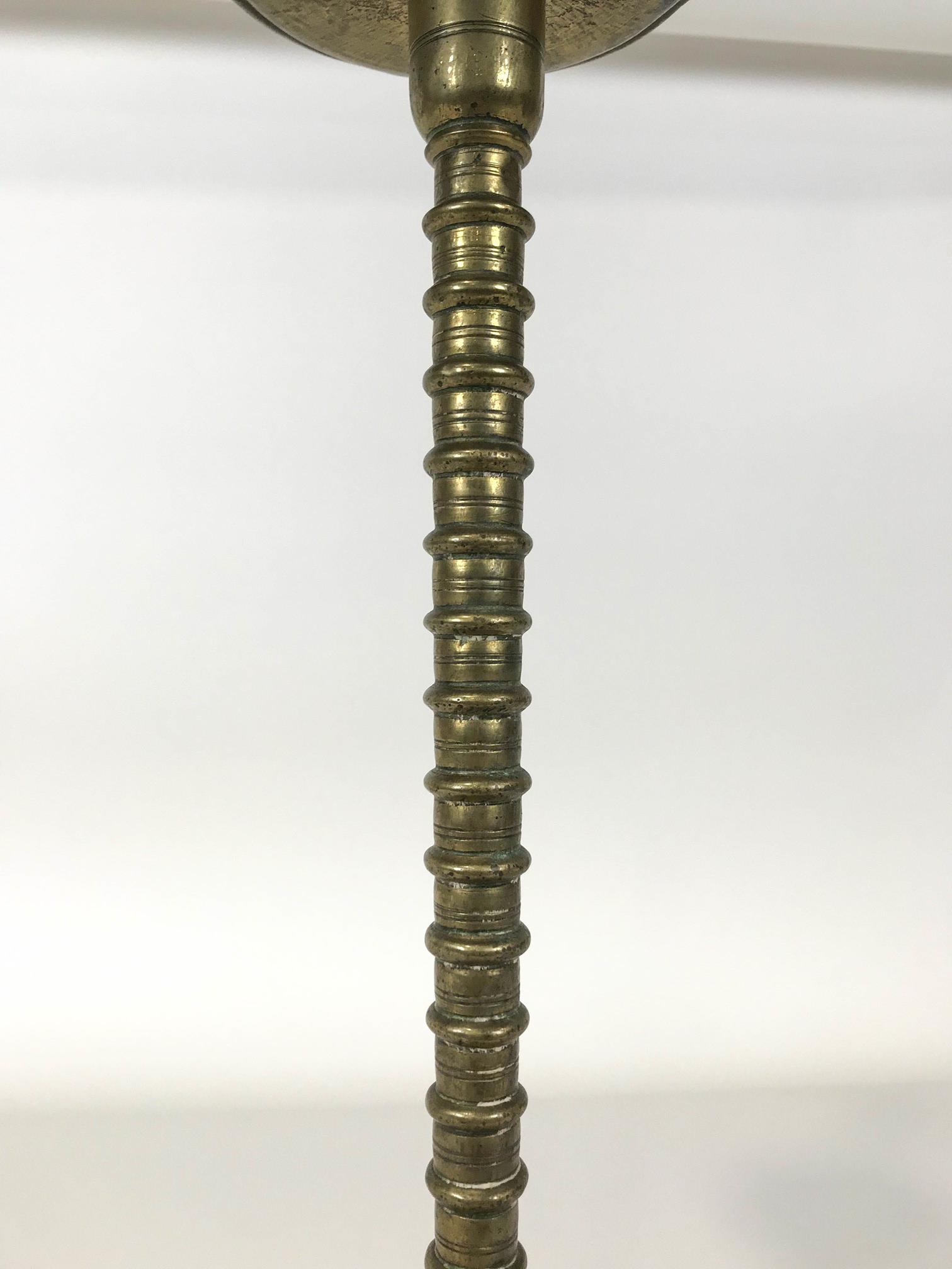 A late 18th/ early 19th century brass candlestick with flared drip pan - Image 4 of 4