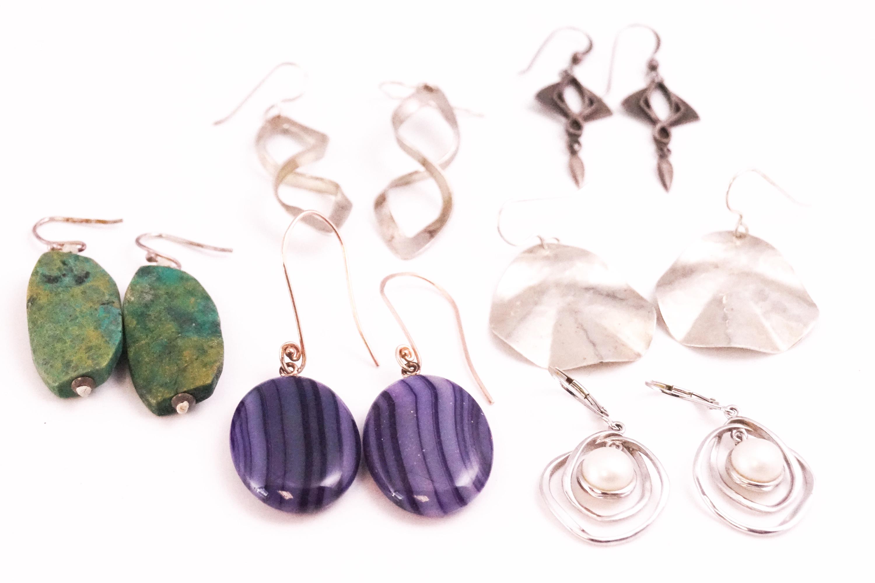 A collection of six pairs of earrings of variable designs. All individually marked 925 for sterling.