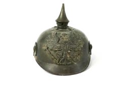 A 1st WW German Prussian brass Pickelhaube helmet, or traditional form,