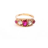 A yellow metal half hoop ring set with synthetic rubies and cubic zirconia.