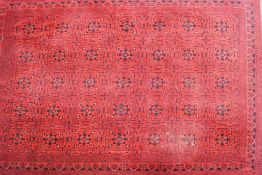 A rectangular carpet of red ground,