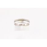 A heavy 4.5mm court wedding ring grain set with diamonds stated to weigh 0.28cts.