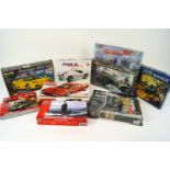 A collection of Airfix, Revell, Tamiya and Burago model kits, including a Jaguar XK 120 roadster,