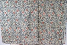 Three William Morris style curtains, lined with red flowers and blue leaves and branches,