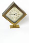 A boxed Staiger quartz brass cased clock, with baton dial and receipt,