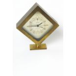 A boxed Staiger quartz brass cased clock, with baton dial and receipt,