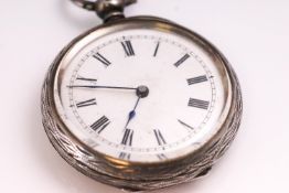 A hallmarked sterling silver open face engraved case pocket watch. Key wound movement.