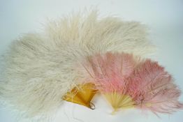 A white ostrich feather fan on faux blond tortoiseshell sticks and guards, 68cm long,
