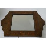 An wood framed mirror, inlaid with figures and stylised foliage,