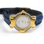 A mixed metal quartz dress watch. Dial signed Fred Paris. Date feature; leather strap.